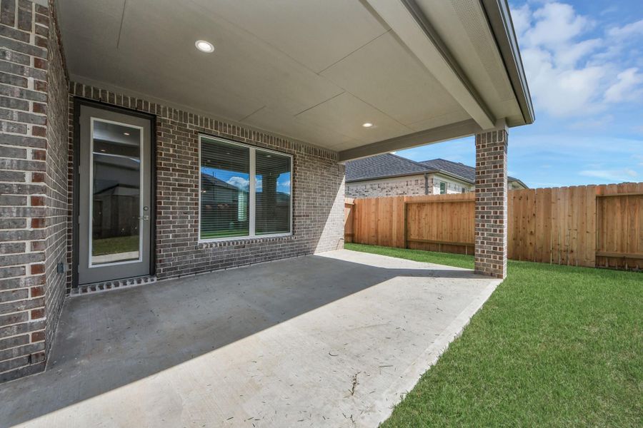 Come and see this spacious backyard with its beautiful covered patio. There is plenty of room for the kids to play and adults to relax. Perfect for your outdoor living space, patio furniture, bbq pit, and so much more. The possibilities are endless!