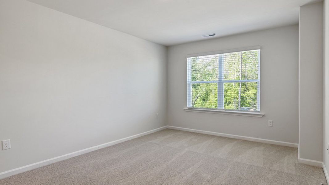 Spacious, unfurnished interior of a new home in Edinborough Townes, Gibsonville (Image 11).