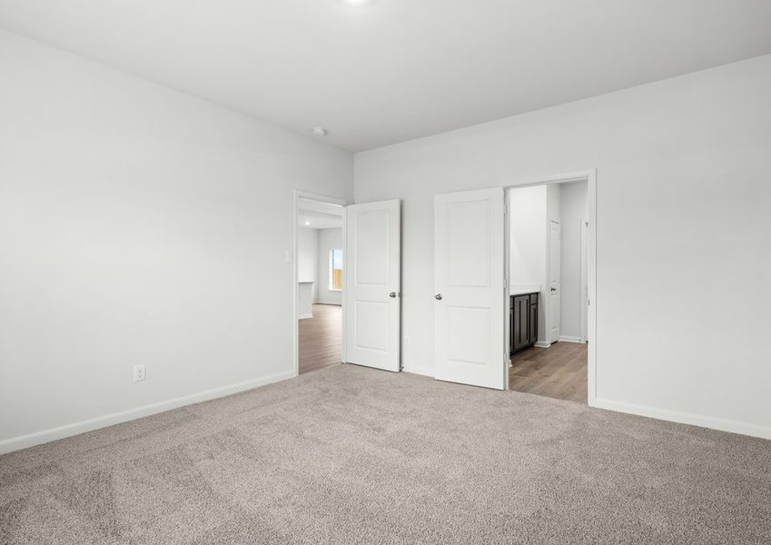 The master suite has a large bedroom, ensuite bathroom and walk-in closet.