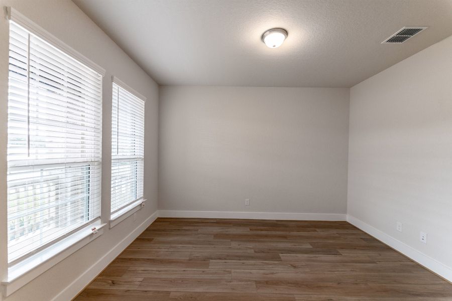 Spacious, unfurnished interior of a new home in The Woodlands at Medina Hills, Mico (Image 11).