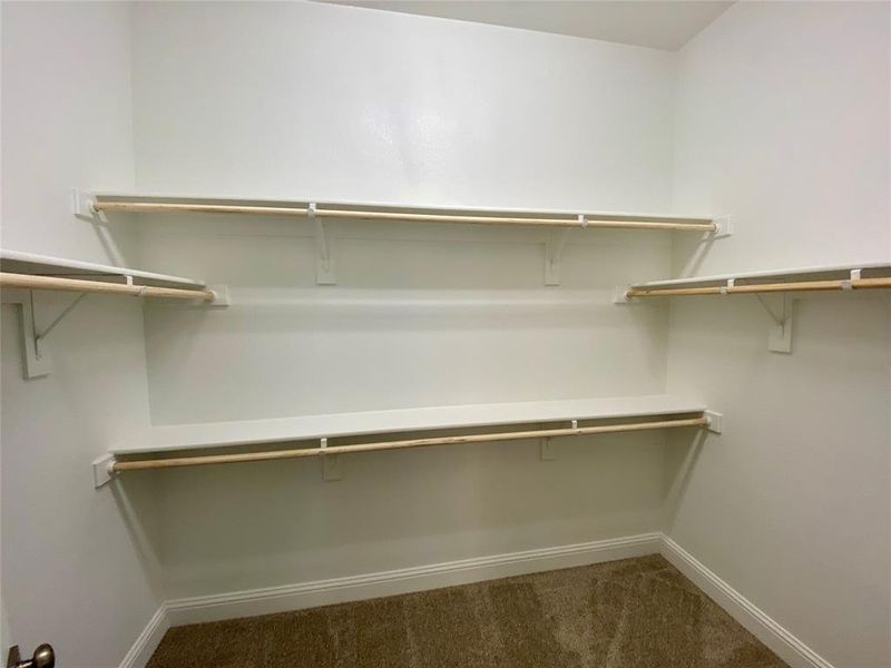 Large walk in master closet with lots of storage space.