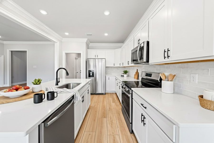 Front exterior of a new home in Young Oaks, Crestview, FL, highlighting curb appeal (Image 2).