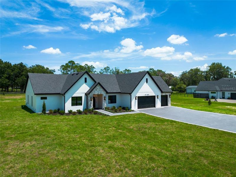 Front exterior of a new home in , Dade City, FL, highlighting curb appeal (Image 28).
