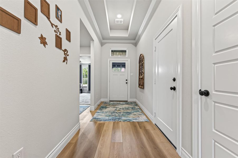 Spacious 25’ x 6’ entry hall featuring two large closets for convenient storage and organization. Spacious 25’ x 6’ entry hall featuring two large closets for convenient storage and organization.
