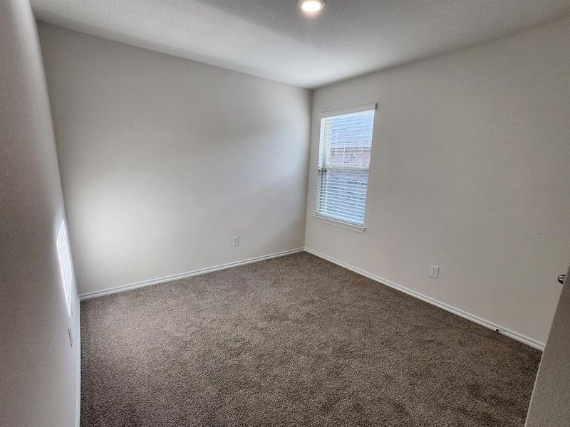 Unfurnished room with carpet floors and baseboards