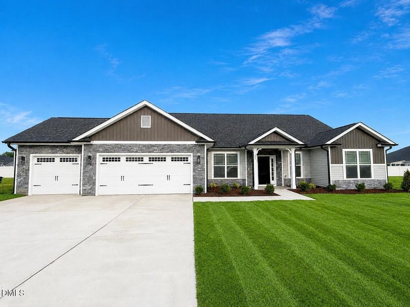 Front exterior of a new home in Jackson Ridge, Pikeville, NC, highlighting curb appeal (Image 1). Front exterior of a new home in Jackson Ridge, Pikeville, NC, highlighting curb appeal (Image 1).