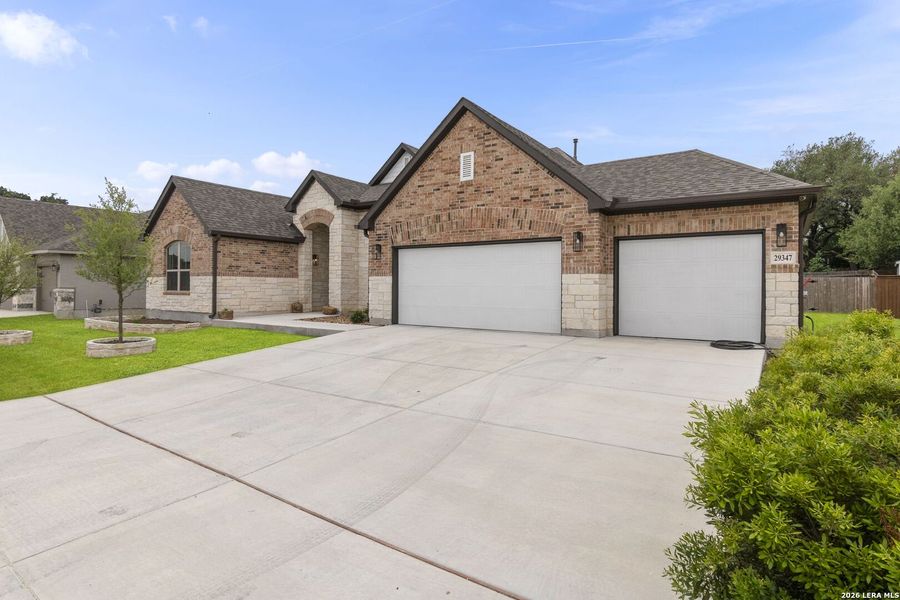 Front exterior of a new home in Elkhorn Ridge, Boerne, TX, highlighting curb appeal (Image 21).