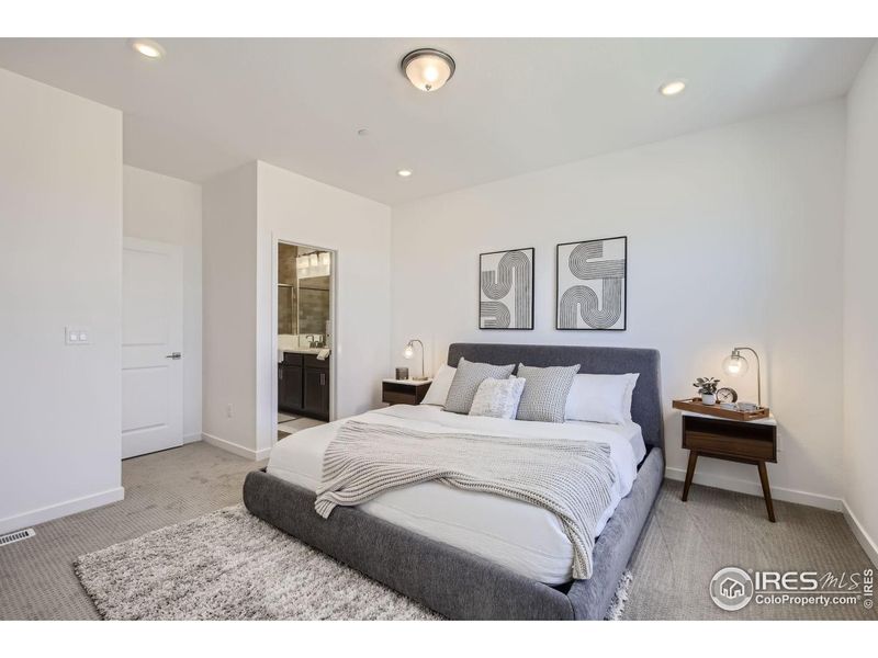 spacious primary, comfortably fits king bed