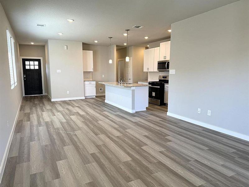 Open Floor Plan layout with Kitchen, Dining area, and Living Area