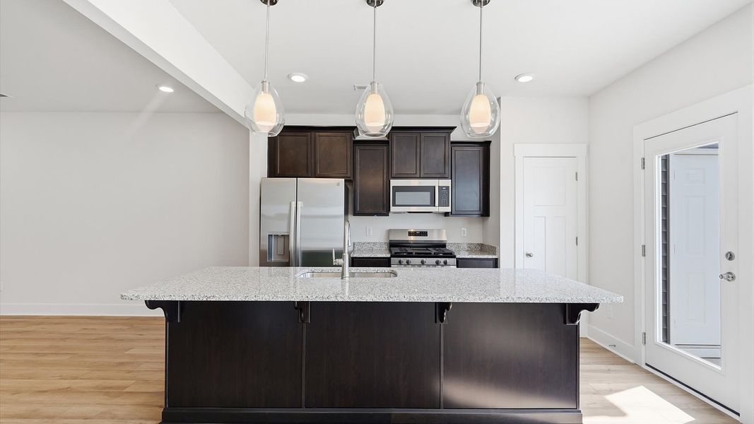 Well-designed kitchen with a center island and tasteful finishes that elevate everyday living at Marion Square