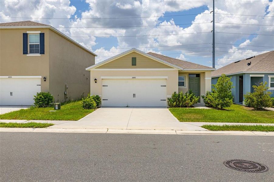 Front exterior of a new home in , Kissimmee, FL, highlighting curb appeal (Image 2). Front exterior of a new home in , Kissimmee, FL, highlighting curb appeal (Image 2).