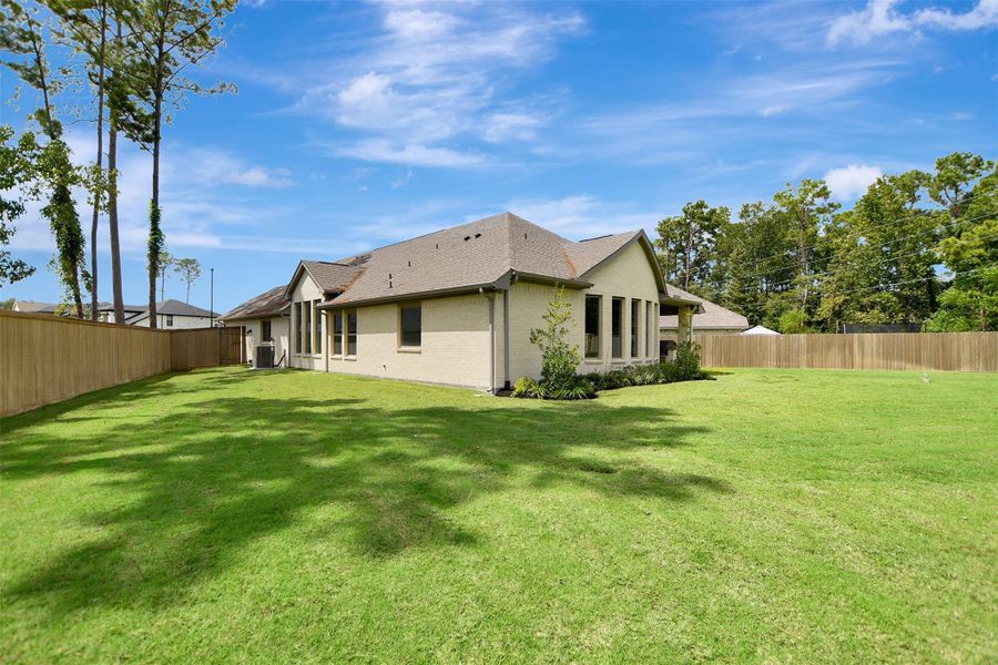 Exterior details and patio area of a home in The Highlands, Porter (Image 28).
