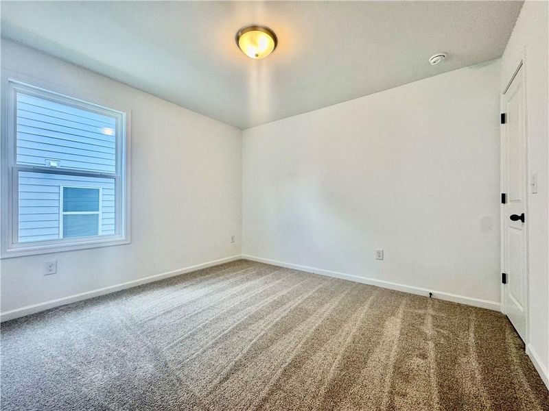 Spacious, unfurnished interior of a new home in Eastlyn Crossing, Flowery Branch (Image 31).