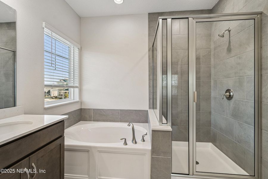 Furnished interior view inside a new home in Tributary 70', Yulee (Image 14).