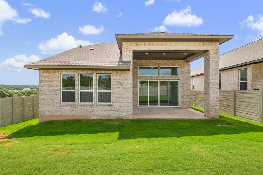 Front exterior of a new home in Arbor Collection At Wolf Ranch, Georgetown, TX, highlighting curb appeal (Image 26).