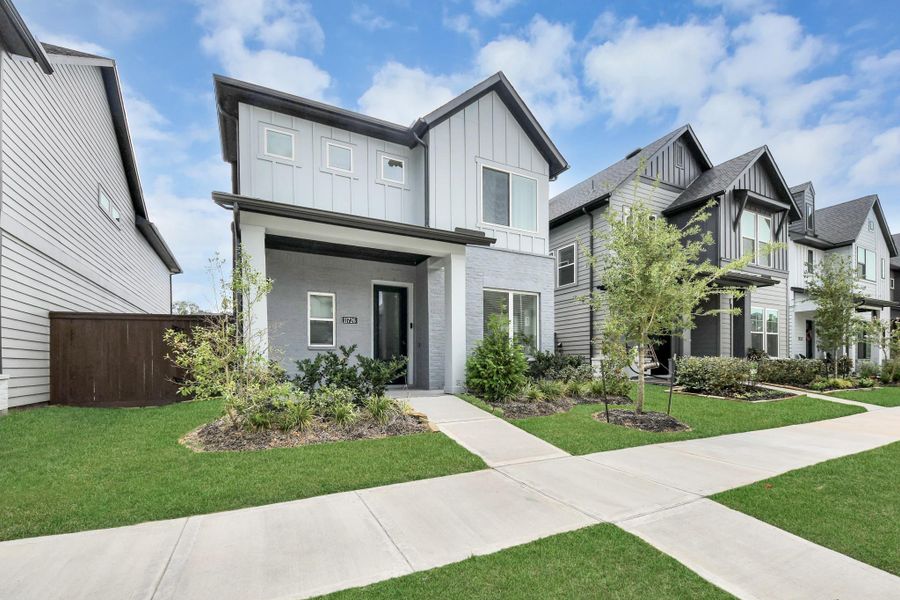 Front exterior of a new home in The Groves 35', Humble, TX, highlighting curb appeal (Image 29). Front exterior of a new home in The Groves 35', Humble, TX, highlighting curb appeal (Image 29).