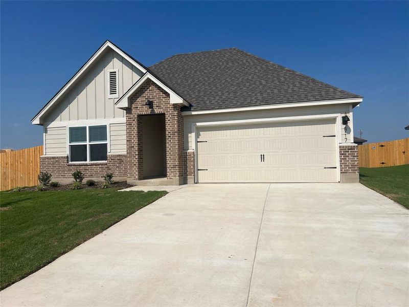 Front exterior of a new home in Park Meadows, Lorena, TX, highlighting curb appeal (Image 1).
