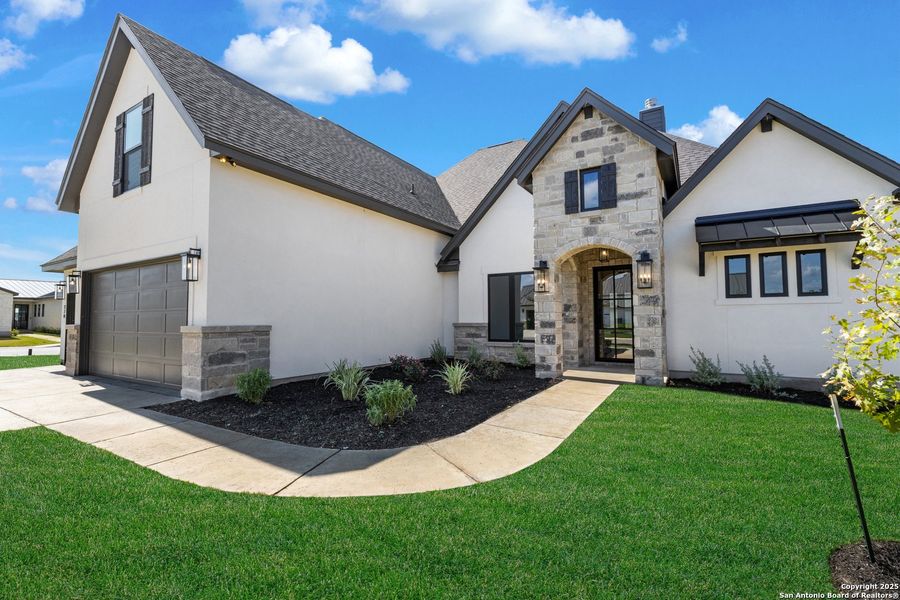 Front exterior of a new home in , Castroville, TX, highlighting curb appeal (Image 21).