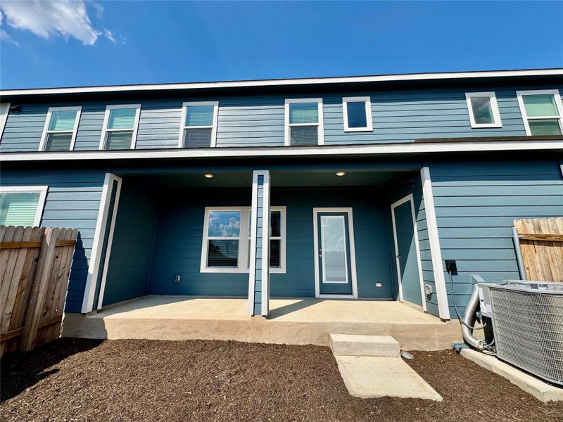 Back of property featuring a porch