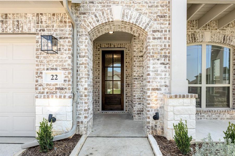 Front exterior of a new home in Mockingbird Hills 60-65, Joshua, TX, highlighting curb appeal (Image 26). Front exterior of a new home in Mockingbird Hills 60-65, Joshua, TX, highlighting curb appeal (Image 26).