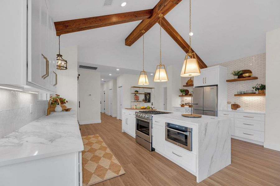 Primary residence offers a Kitchen Aid appliance package for refrigerator, dishwasher, range. Best 30" Downdraft Hood with LED Lighting, Self-closing cap hides the lowered downdraft completely, leaving your counter unobstructed and clear.  Built-in ZLINE microwave drawer.  Built-in wine shelfUnder cabinet LED lighting