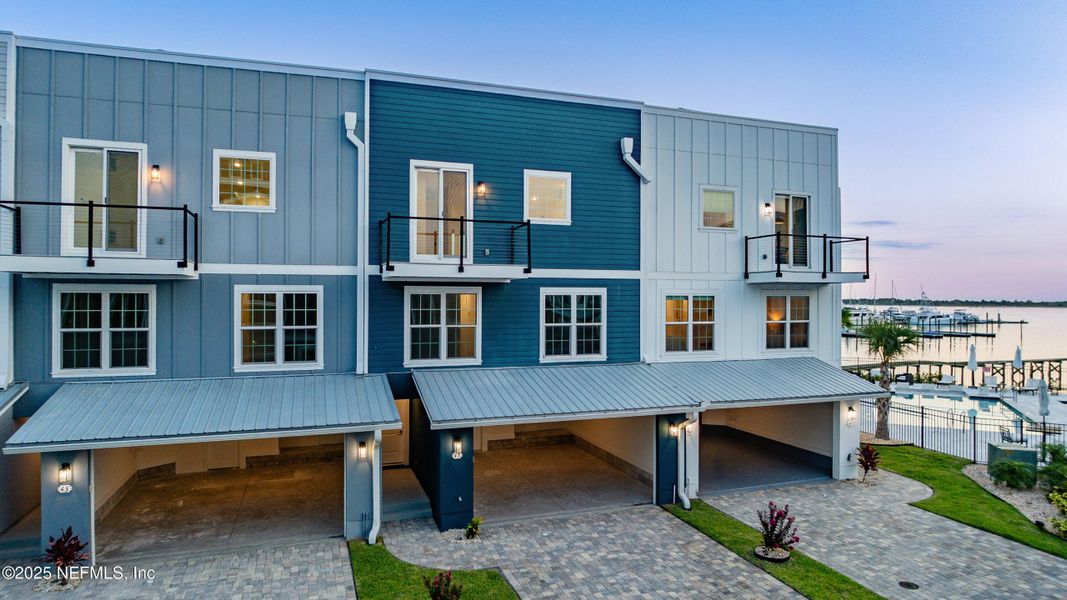 Front exterior of a new home in , St. Augustine, FL, highlighting curb appeal (Image 1).