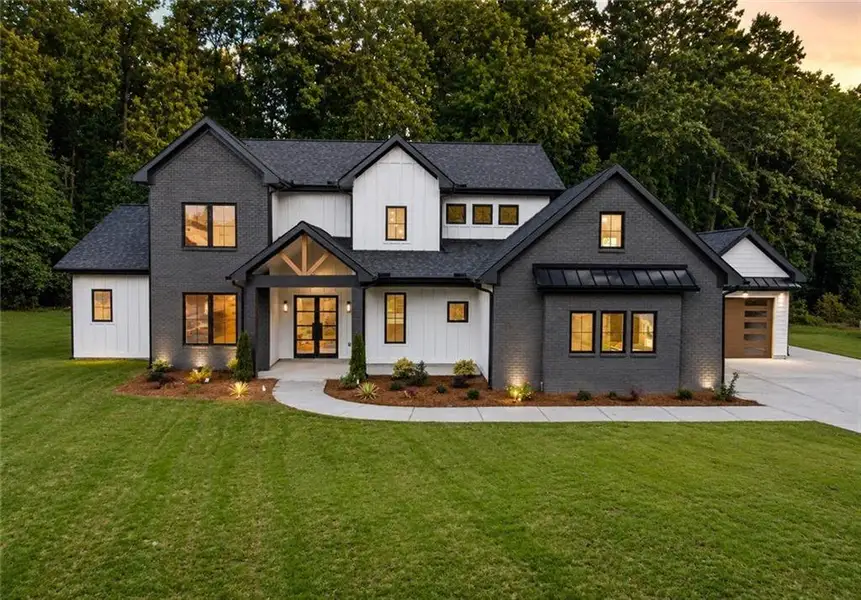 Front exterior of a new home in , Cumming, GA, highlighting curb appeal (Image 2). Front exterior of a new home in , Cumming, GA, highlighting curb appeal (Image 2).