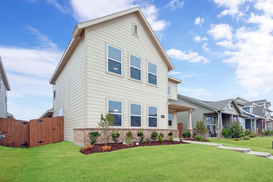 Representative exterior photo of a completed home built from the Harwood by Impression Homes in Heartland, Heartland, TX (Image 2).