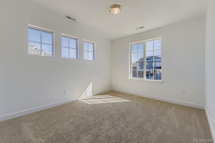Spacious, unfurnished interior of a new home in Newlin Crossing: The Monarch Collection, Parker (Image 13). Spacious, unfurnished interior of a new home in Newlin Crossing: The Monarch Collection, Parker (Image 13).