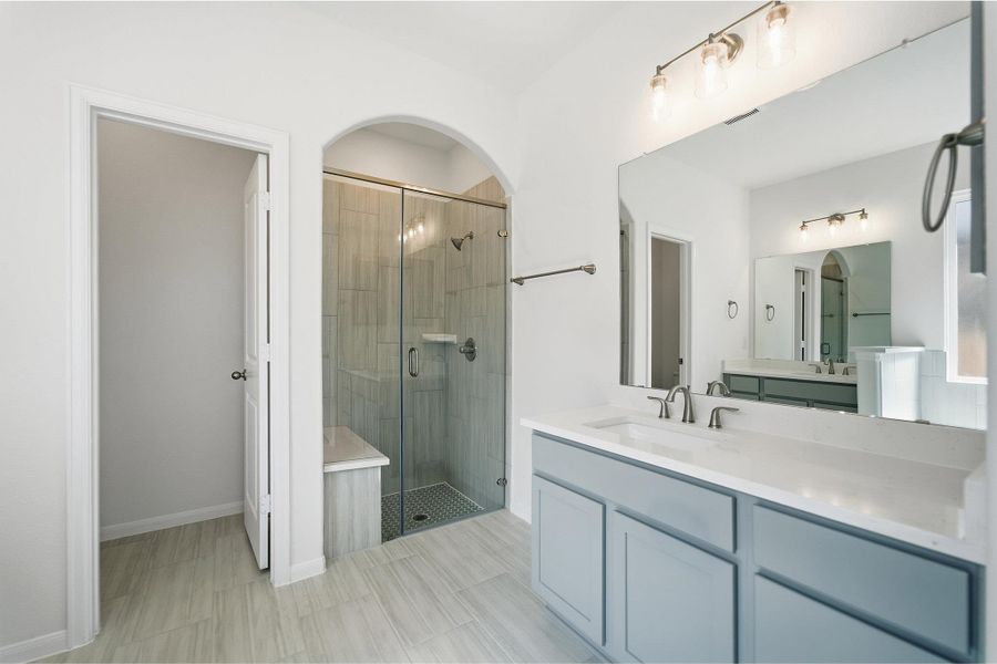 Bathroom with vanity and a shower stall
