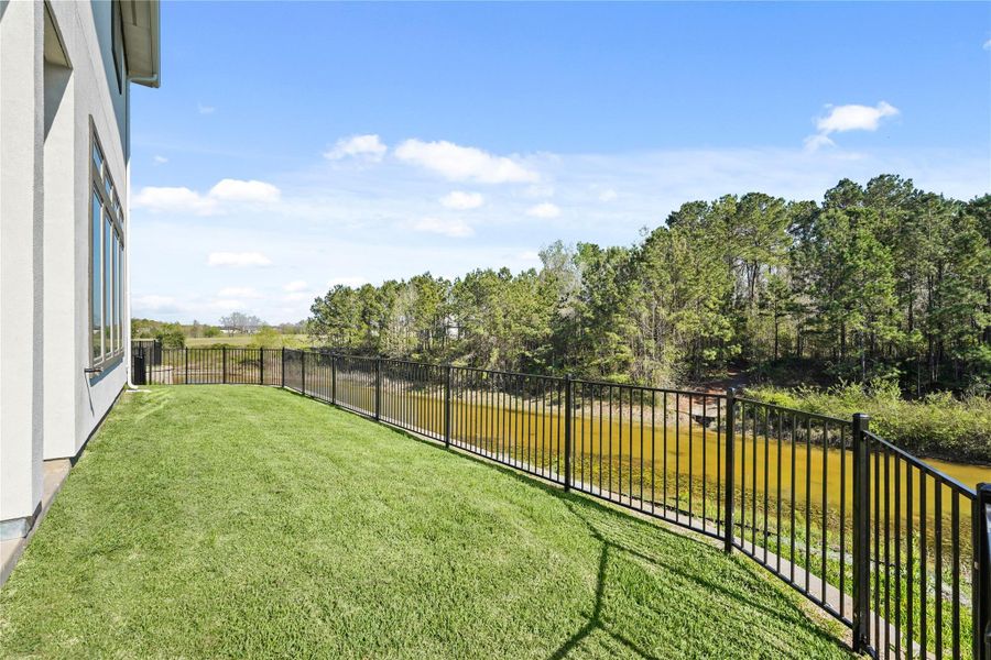 Exterior details and patio area of a home in Waterstone on Lake Conroe, Montgomery (Image 4).