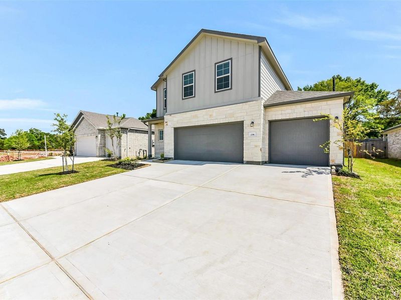 Front exterior of a new home in Windmill Estates, Magnolia, TX, highlighting curb appeal (Image 26).