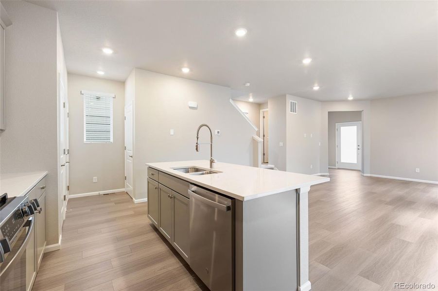 Furnished interior view inside a new home in Woodrose at Painted Prairie, Aurora (Image 9).