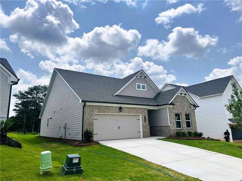 Front exterior of a new home in Summerlin, Winder, GA, highlighting curb appeal (Image 23).