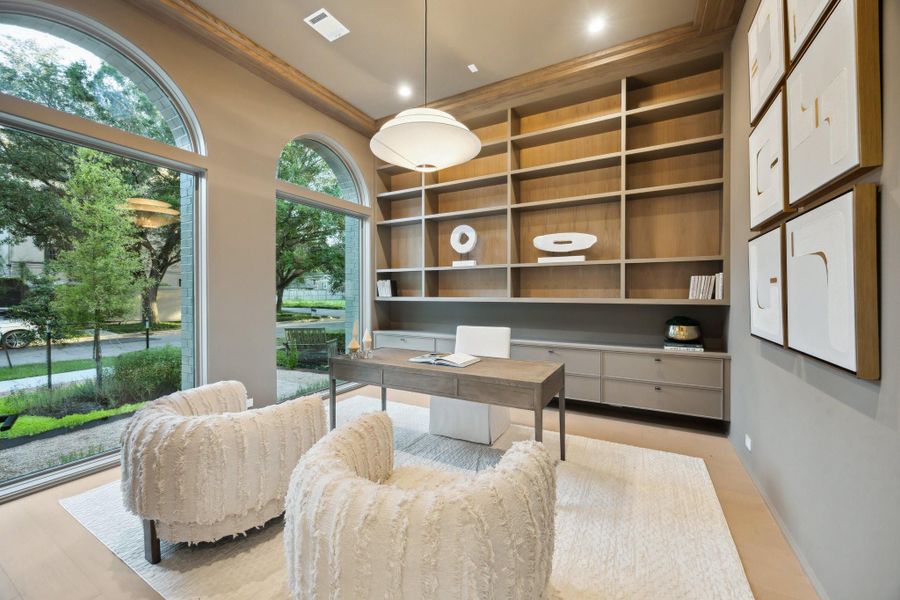 Library off the entrance of the home with large windows curved windows, White Oak Built-In Shelving with a floating counter and drawers. Custom paint color and a simple but elegant pendant light. Library off the entrance of the home with large windows curved windows, White Oak Built-In Shelving with a floating counter and drawers. Custom paint color and a simple but elegant pendant light.