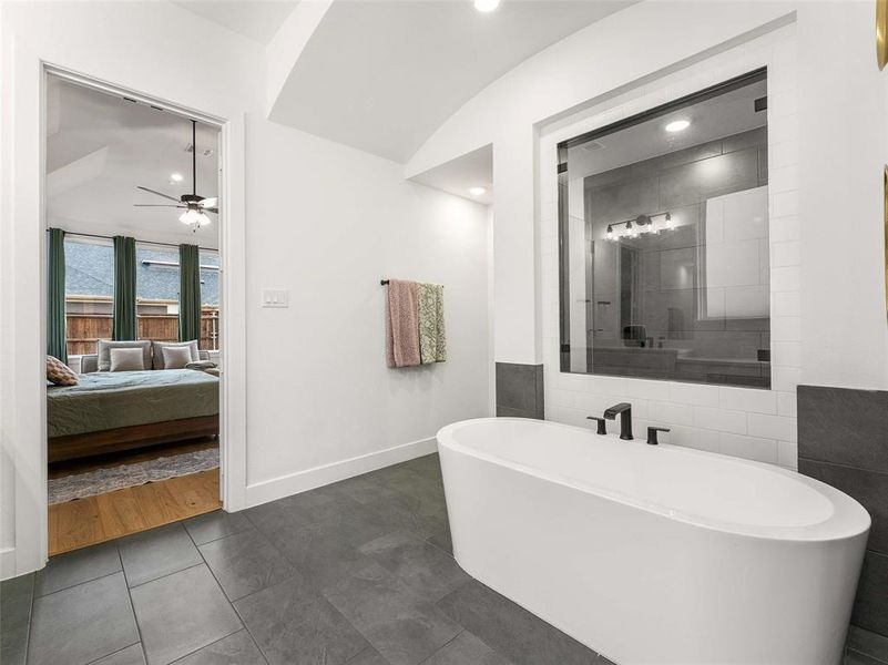 A soaking tub and oversized walk in shower