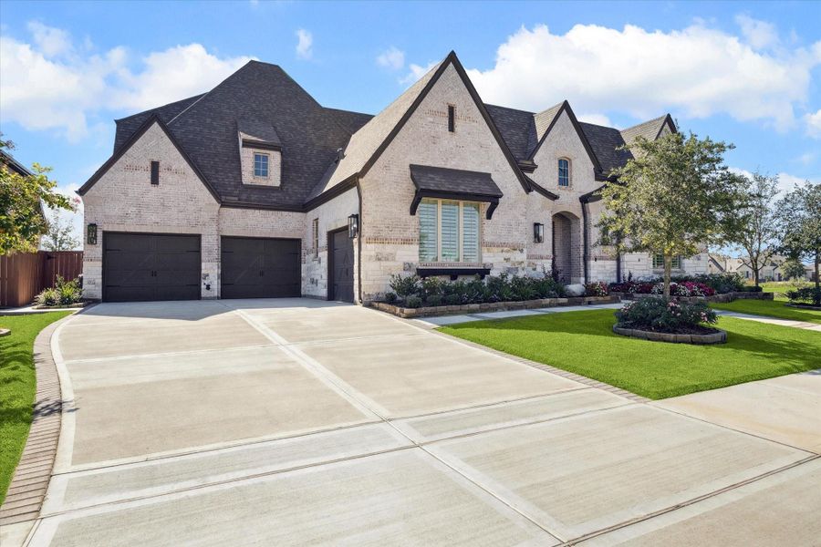 Front exterior of a new home in Elyson, Katy, TX, highlighting curb appeal (Image 20).