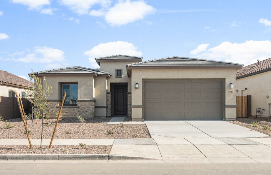 Front exterior of a new home in Artisan at Asante, Surprise, AZ, highlighting curb appeal (Image 23).