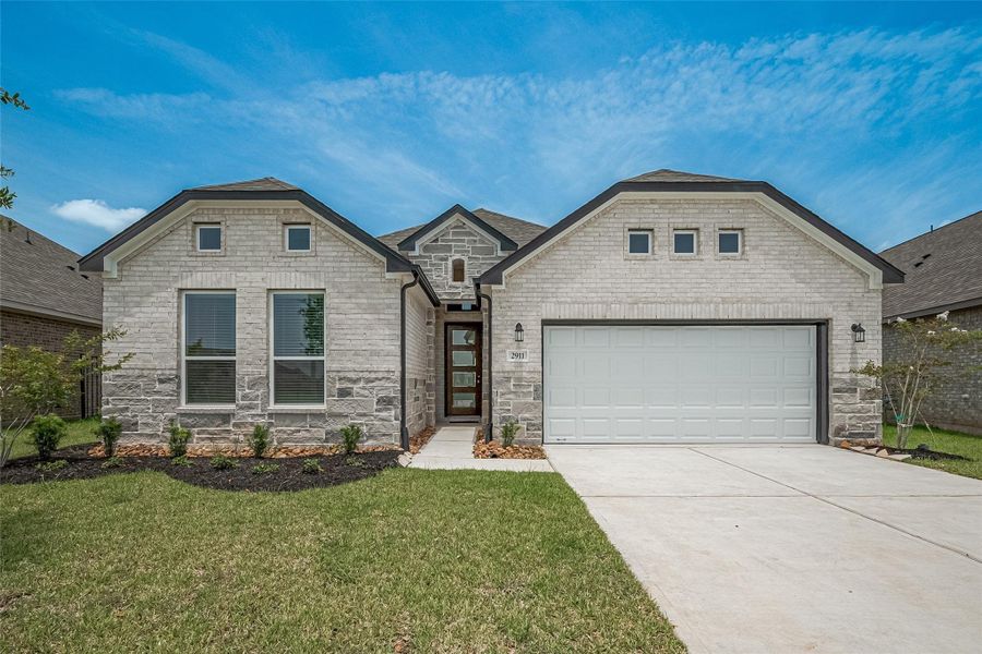 Front exterior of a new home in Lago Mar, Texas City, TX, highlighting curb appeal (Image 26).