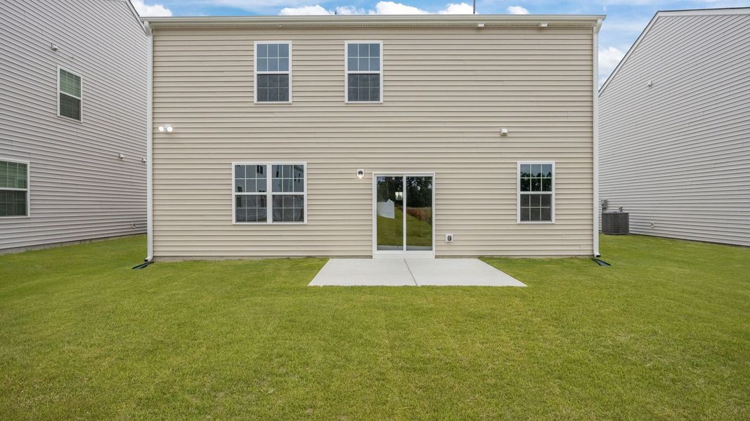 Exterior details and patio area of a home in Ridgewood Farms, Winterville (Image 19).