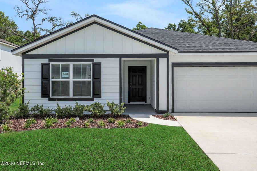 Front exterior of a new home in Wilford Oaks, Orange Park, FL, highlighting curb appeal (Image 1). Front exterior of a new home in Wilford Oaks, Orange Park, FL, highlighting curb appeal (Image 1).