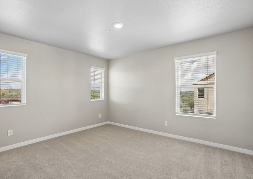 The master bedroom has large windows.