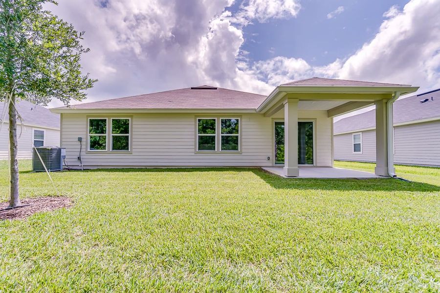 Front exterior of a new home in Anabelle Island - Executive Series, Green Cove Springs, FL, highlighting curb appeal (Image 2). Front exterior of a new home in Anabelle Island - Executive Series, Green Cove Springs, FL, highlighting curb appeal (Image 2).
