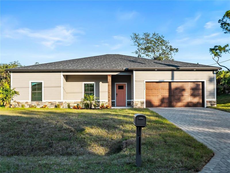Front exterior of a new home in , North Port, FL, highlighting curb appeal (Image 28).
