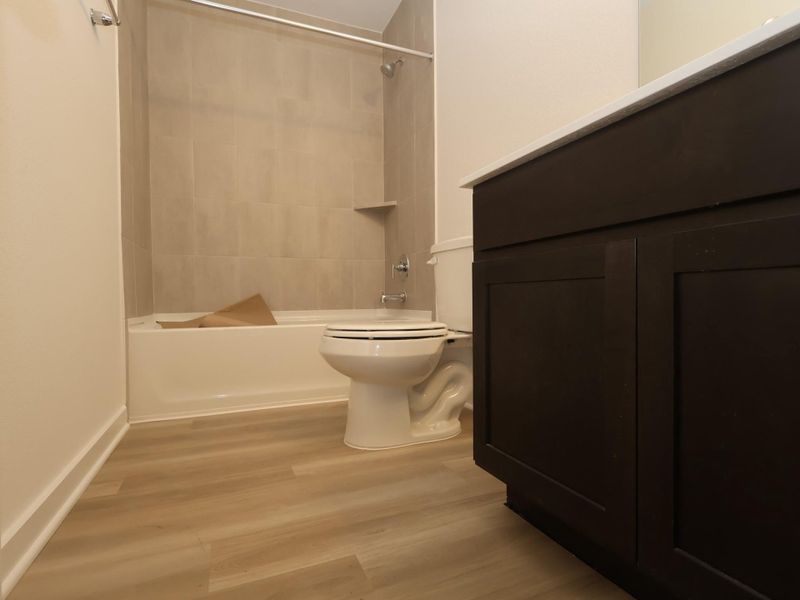 Furnished interior view inside a new home in Lone Star Landing, Montgomery (Image 15).