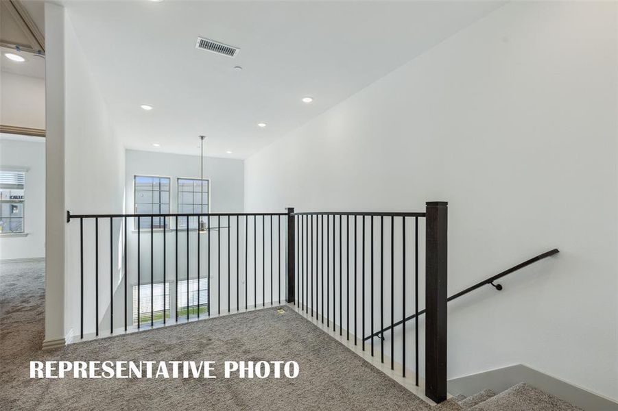 The open and airy loft, located at the top of the stairs, makes a perfect office area or reading nook.  REPRESENTATIVE PHOTO