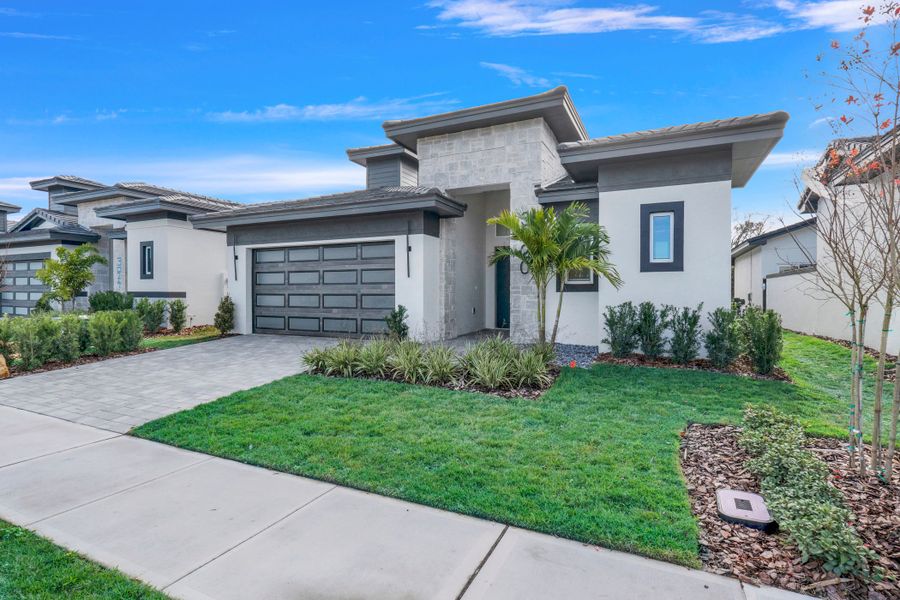 Representative exterior photo of a completed home built from the Courtyard 50 3BR by ABD Development in Hampton Green at Providence, Davenport, FL (Image 32).