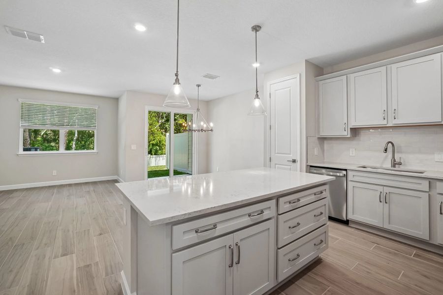 Beautiful kitchen welcomes you in to this open concept space