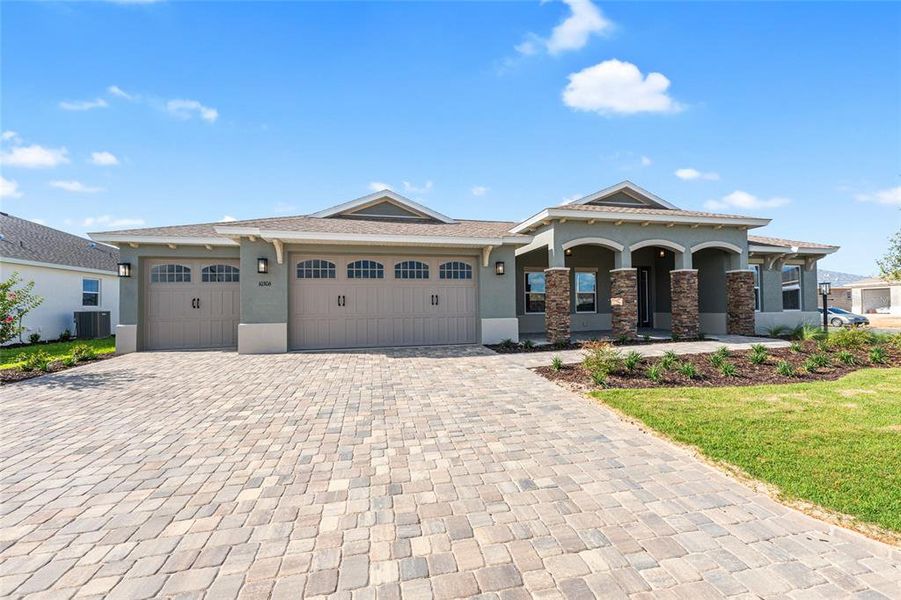 Front exterior of a new home in , Ocala, FL, highlighting curb appeal (Image 1). Front exterior of a new home in , Ocala, FL, highlighting curb appeal (Image 1).
