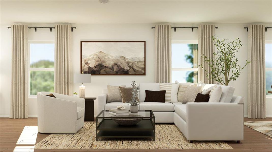 Living room with light wood-type flooring and a wealth of natural light